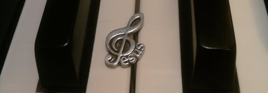 Piano keys with Jesus symbol